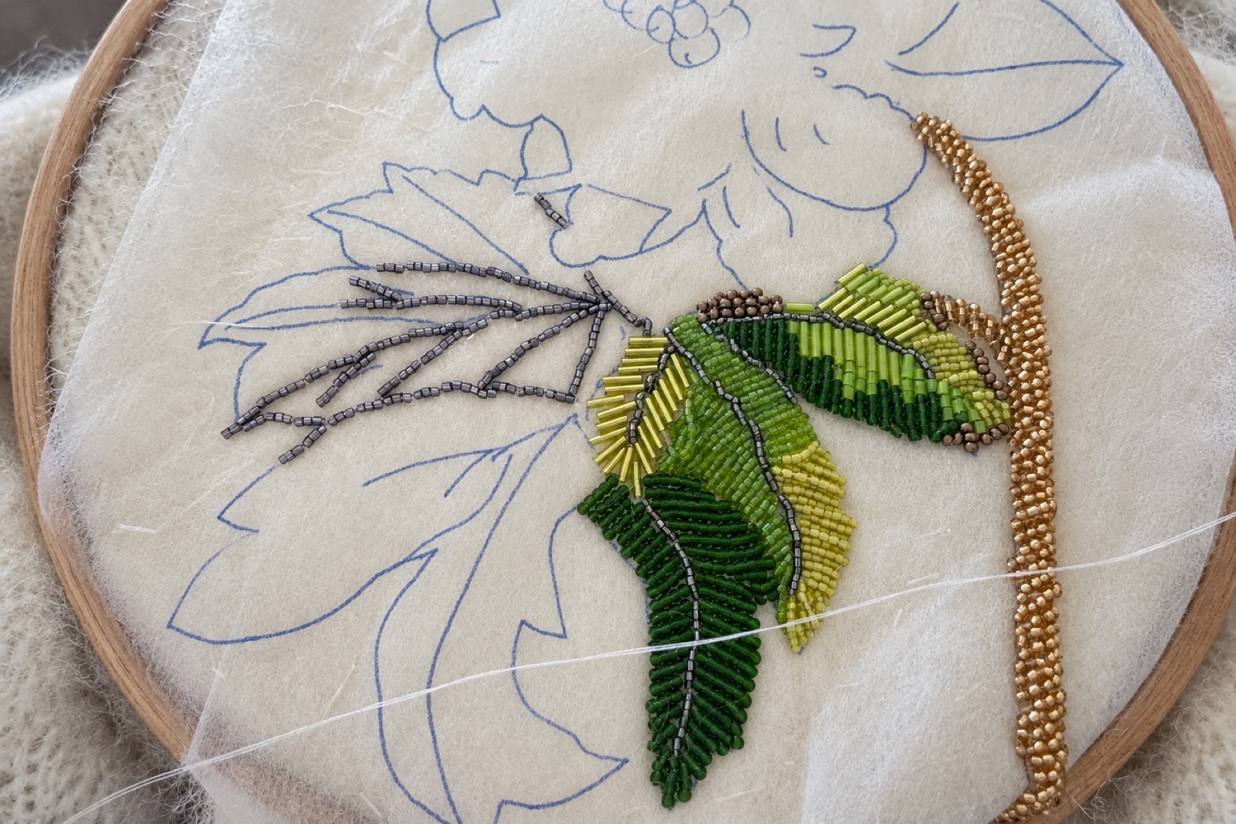 Hand beading process on knitwear
