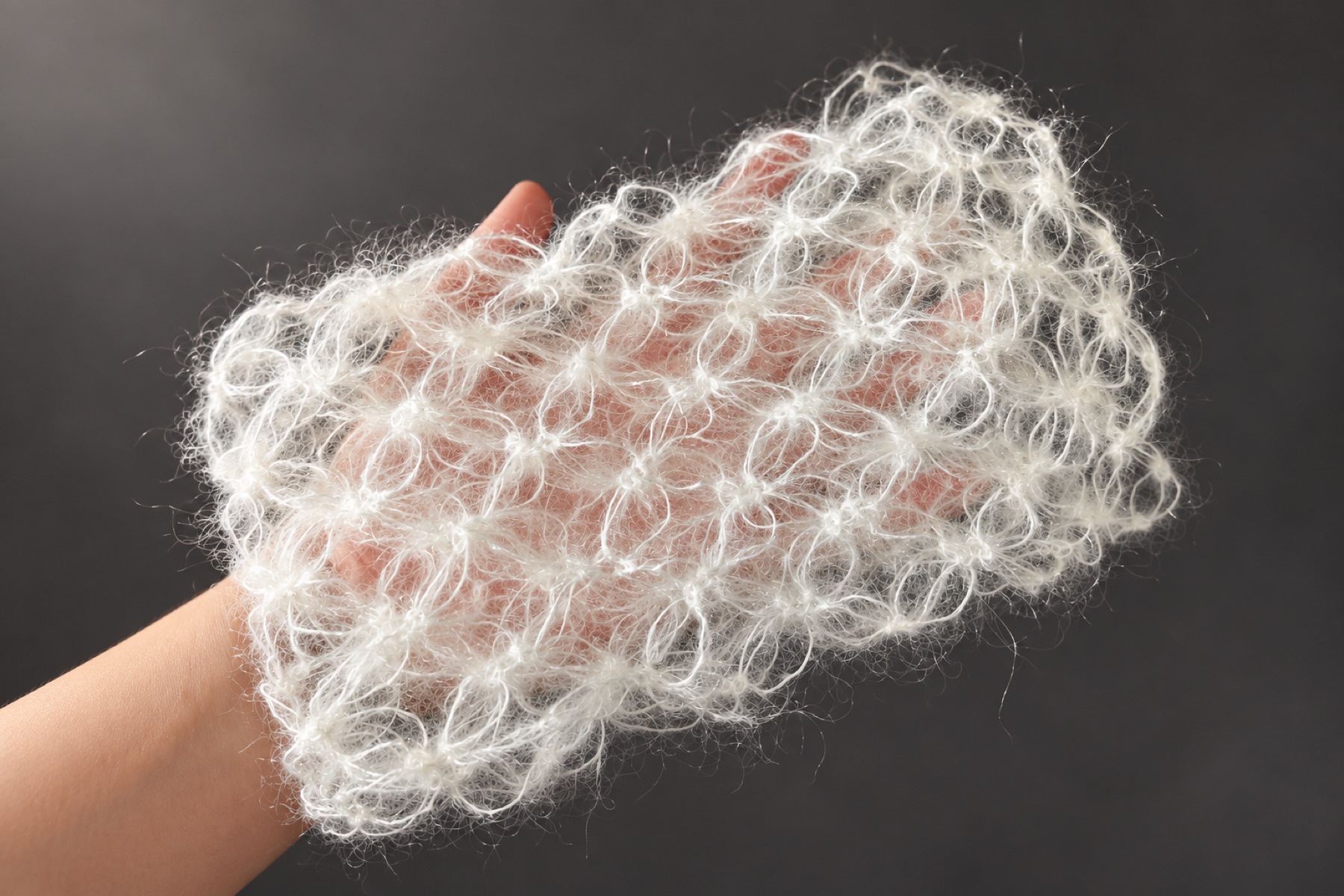 A hand-held novelty yarn swatch