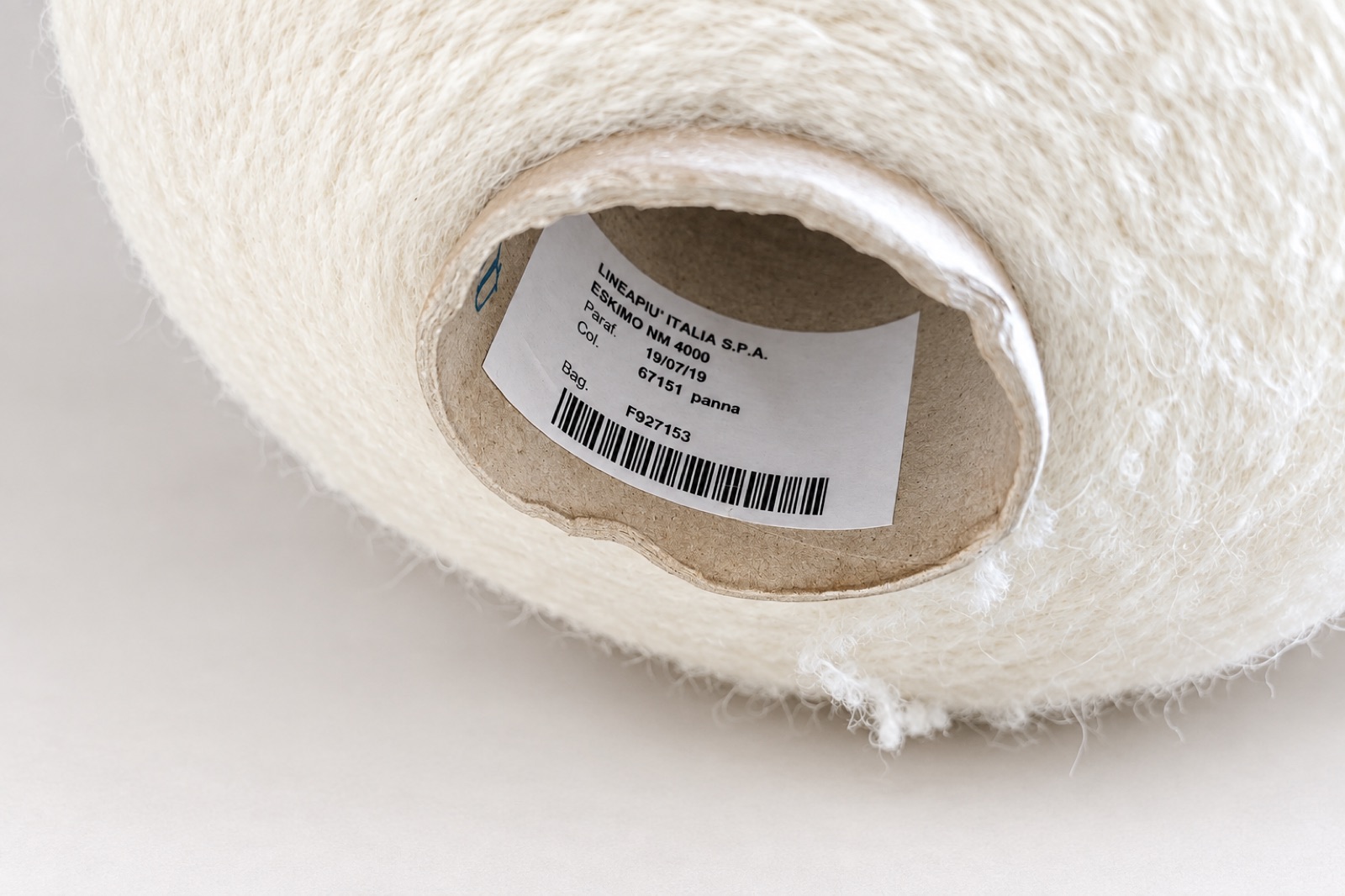 Cream textured yarn with a Lineapiù Italia label